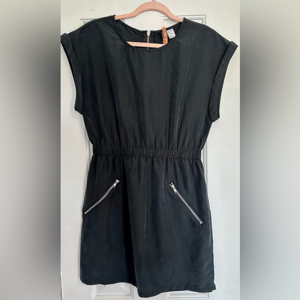Black mini dress  with zipper pockets and back by H&M size 6